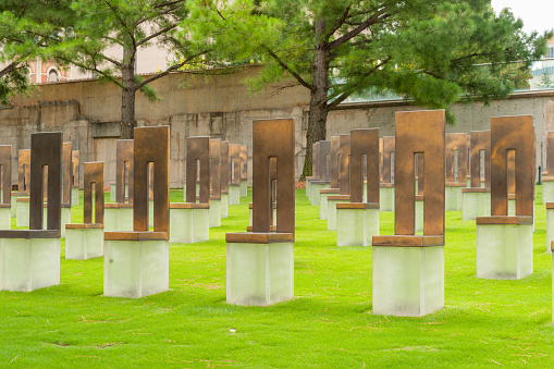 Oklahoma City USA - September 9 2015; Oklahoma City Bombing Field of Empty Chairs a sculpture in bronze and glass remembering the 168 killed in bombing in 1997