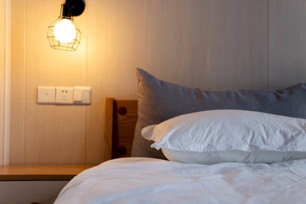 istock A cozy room with a comfortable bed and a nightstand in the hotel under mild light 1267427286