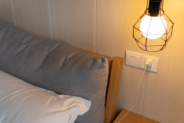 istock A cozy room with a comfortable bed and a nightstand in the hotel under mild light 1267427311