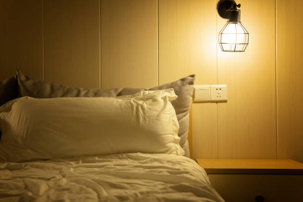istock A cozy room with a comfortable bed and a nightstand in the hotel under mild light 1267427324