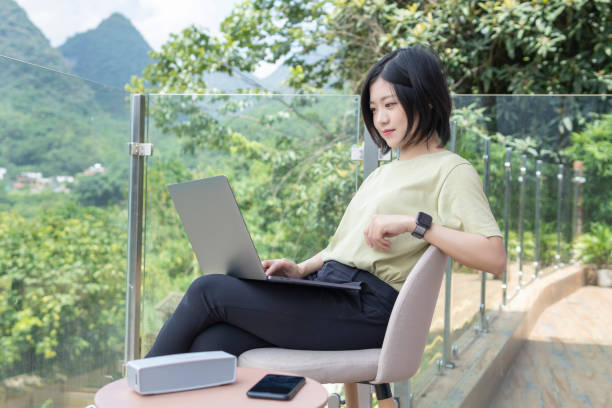 istock A female freelancer using a laptop to work outdoors in the journey 1267427338