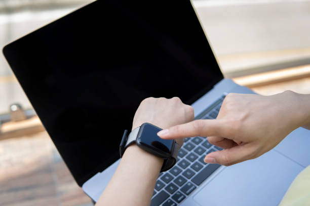 istock An asian young female freelancer using a laptop to work outdoors on the journey 1267427366