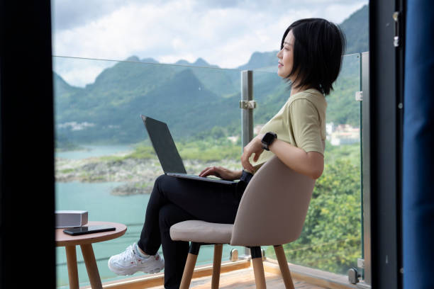 istock A female freelancer using a laptop to work outdoors on the journey 1267427377