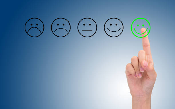 istock Quality control concept. lady hand choosing a happy button. 1267427542