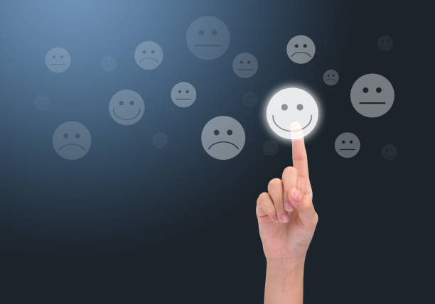 istock Quality control concept. lady hand choosing a happy button. 1267427566