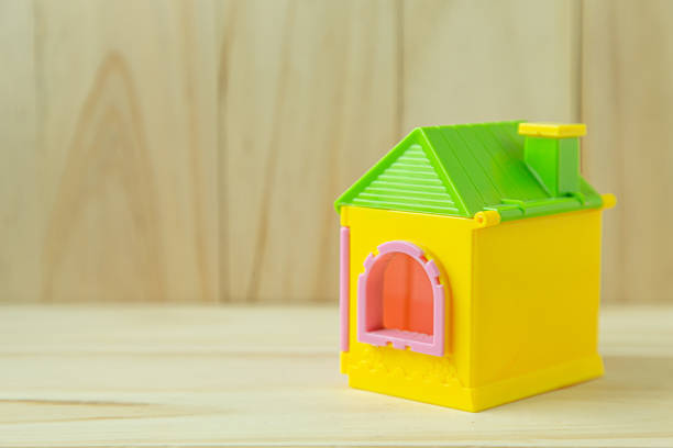 istock home toy on wood for property content. 1267428740