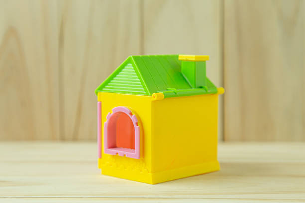 istock home toy on wood for property content. 1267428754