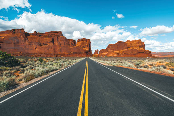 istock Desert road leading into Arches National Park 1267433132