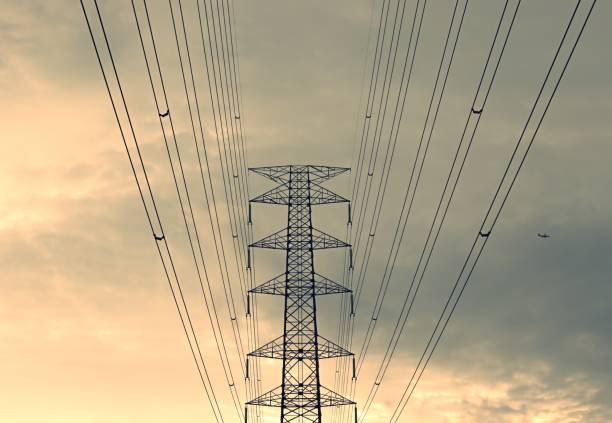 istock High voltage electric pole,high voltage power supply in cloudy day when it is about to rain,Silhouette of high voltage electric pole twilight 1267436564