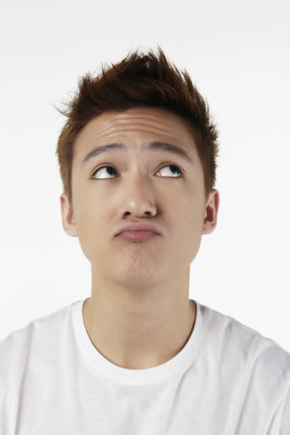 istock Confused man looking up,contemplating 1267436760