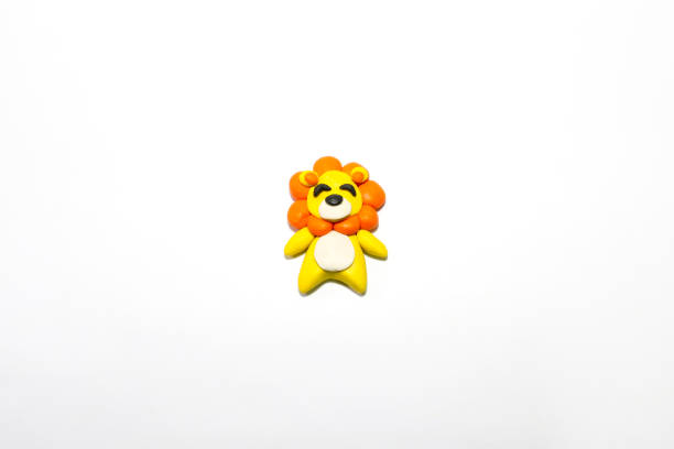 istock Cute lion made of plasticine on white background. 1267437510