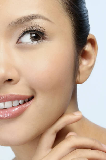 istock Woman touching her face and smiling 1267441155