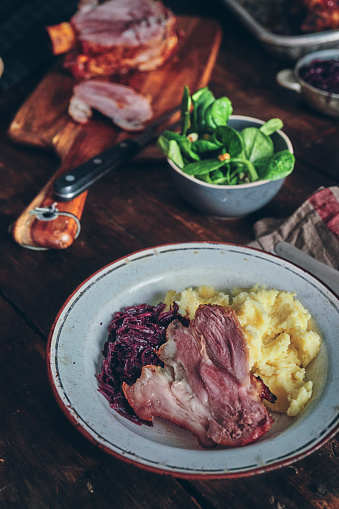 Roasted Ham Hock Served with Sauerkraut and Mashed Potatoes