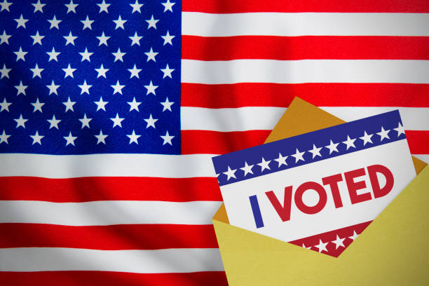 istock USA election concept. American flag and voting envelope. 1267441383