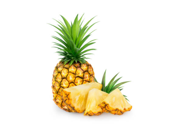 istock whole pineapple and pineapple slice. Pineapple with leaves isolate on white. 1267442190
