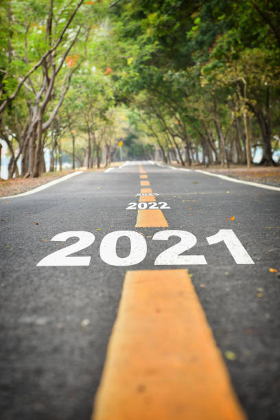 new year 2021 to 2023 on asphalt road surface - decisions nature road street imagens e fotografias de stock