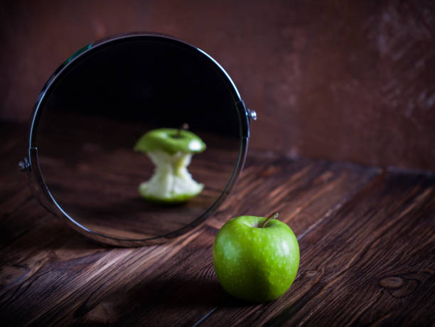 istock Apple reflecting in  the mirror surrealistic picture abstract vision 1267451830