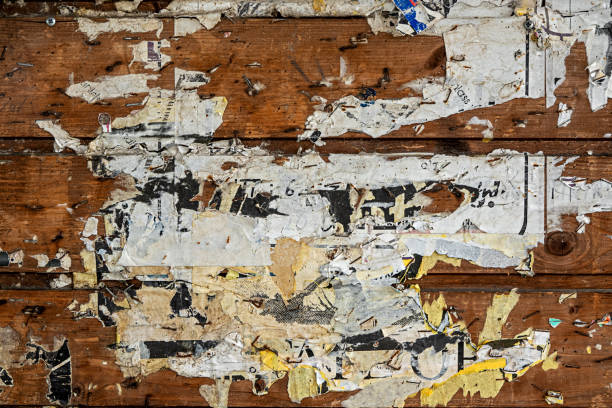 istock texture, background, wooden wall with old torn posters 1267453115