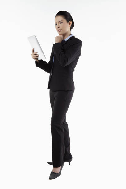 istock Mid adult businesswoman using digital tablet 1267453820