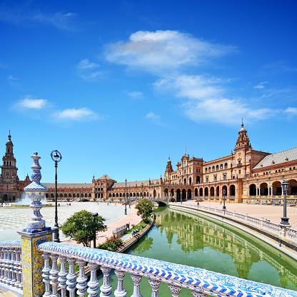 The Plaza de España is a plaza in María Luisa Park, in Seville, Spain. Built in 1928, the Plaza de Espana is huge and takes on a half-elliptic shape, which represents the embrace of Spain and its ancient colonies. The square is surrounded by a long canal that is crossed by four bridges.
