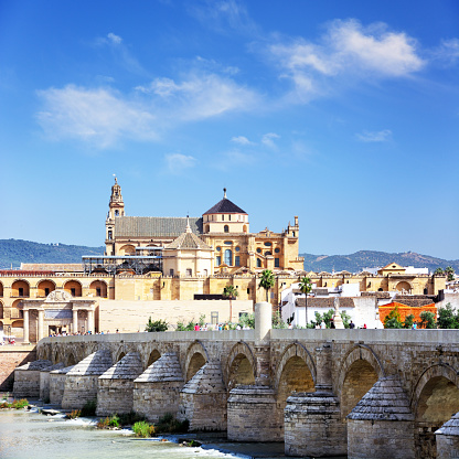 Roman Bridge and Guadalquivir river in Cordoba, Spain. Composite photo