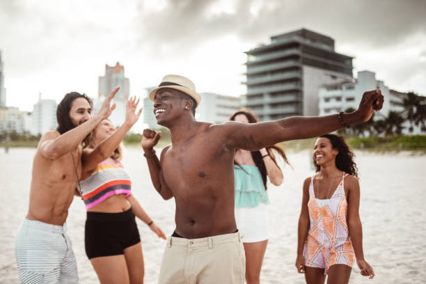 istock friends doing a party at the beach 1267457982