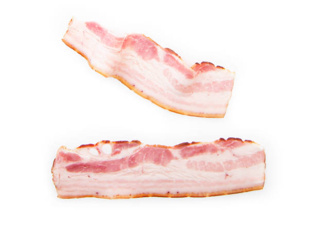 Slices of raw bacon isolated on white background Slices of raw bacon isolated on white background uncooked bacon stock pictures, royalty-free photos & images