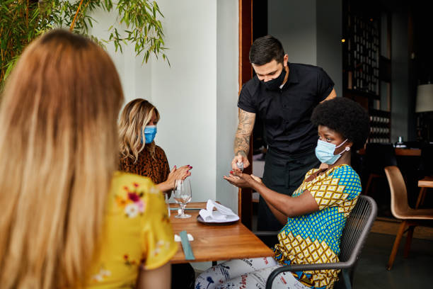 istock Hands Disinfection In Restaurant - New Normal Concept 1267458914