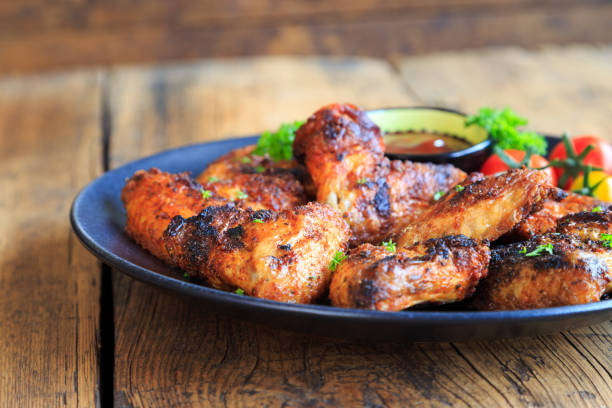 istock delicious chicken wings with a spicy dip 1267459330