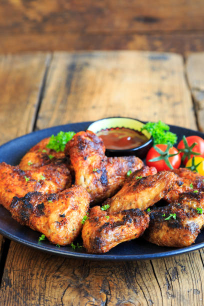 istock delicious chicken wings with a spicy dip 1267459341