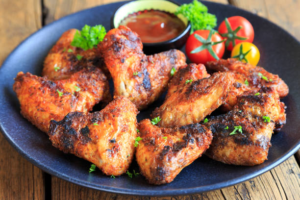 istock delicious chicken wings with a spicy dip 1267459362