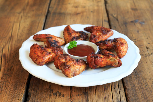 istock delicious chicken wings with a spicy dip 1267459876