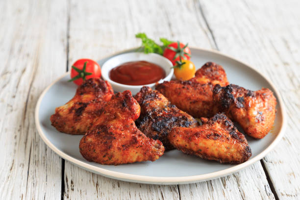 istock delicious chicken wings with a spicy dip 1267459886