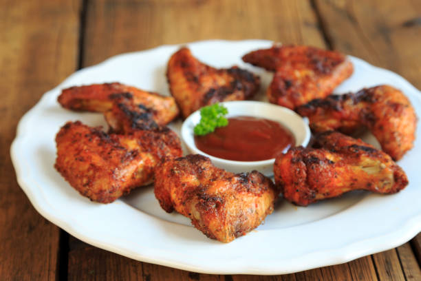 istock delicious chicken wings with a spicy dip 1267460295