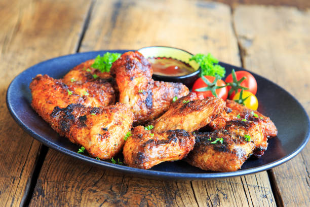 istock delicious chicken wings with a spicy dip 1267460325
