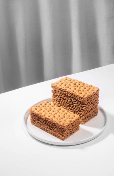 istock Crispbread on a white plate, isometric creative minimalism concept 1267460339