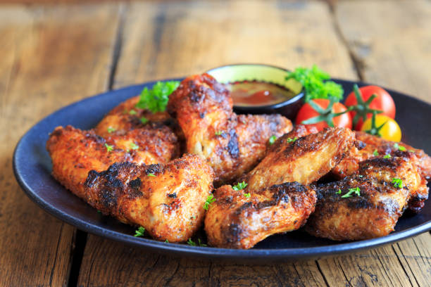 istock delicious chicken wings with a spicy dip 1267460355