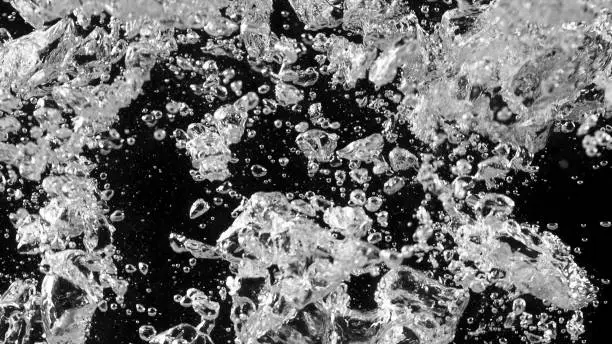 Black water with oxygen bubbles, abstract background