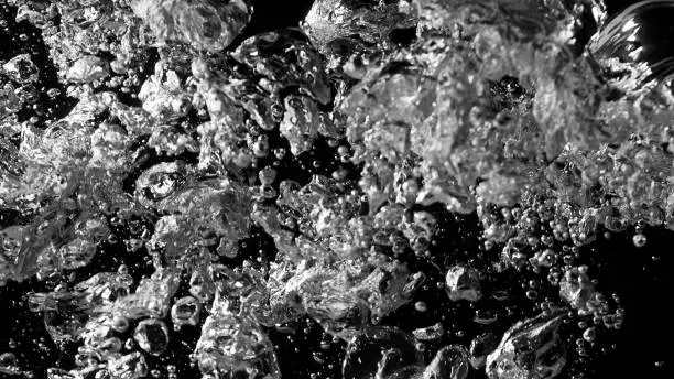 Black water with oxygen bubbles, abstract background