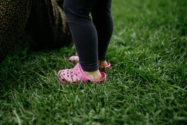 istock Low Section Of Woman Standing On Field 1267464511