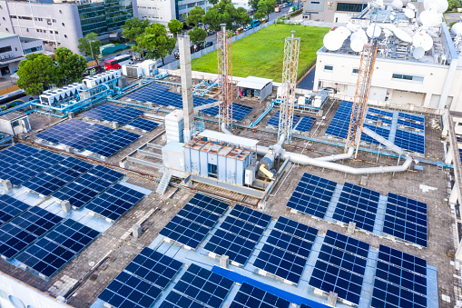 aerial view of solar energy on the roofs of industrial plants