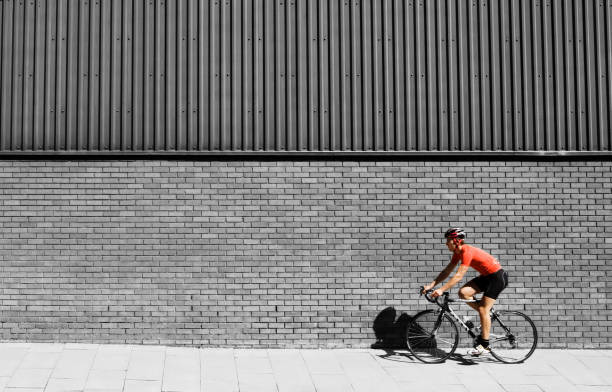 istock Man cycling on bicycle in city 1267465279