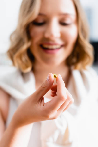 istock selective focus of woman holding pill in hand 1267466045