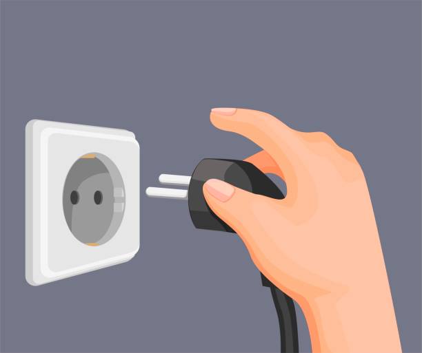 hand setzen elektrische stecker an steckdose inwand. strom energiesparsymbol in cartoon-illustration vektor - saving electricity stock-grafiken, -clipart, -cartoons und -symbole