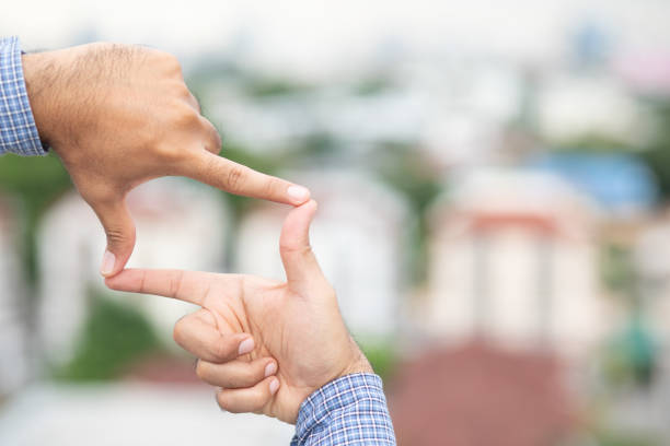 istock Male hands doing hand frames and looking at city view. 1267469089