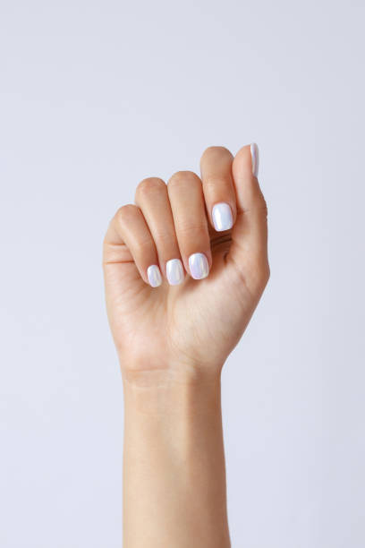 istock Gesture and sign, hand holds something on a light background 1267469300