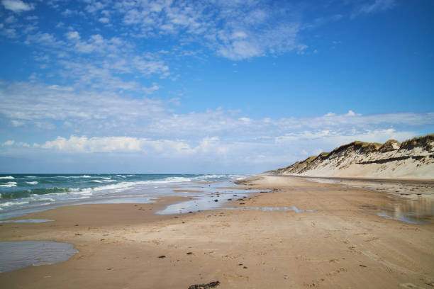 istock The blue sky, beach, a hill and the ocean 1267470316