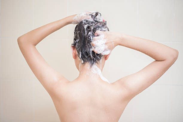 istock Happy  beautiful woman is taking a shower 1267470776