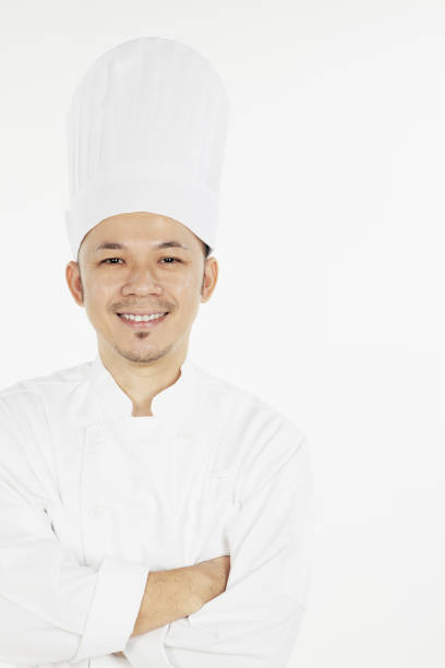 istock Asian chef posing with arms crossed 1267472083
