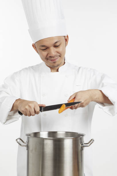 istock Asian chef preparing a wholesome meal 1267473106
